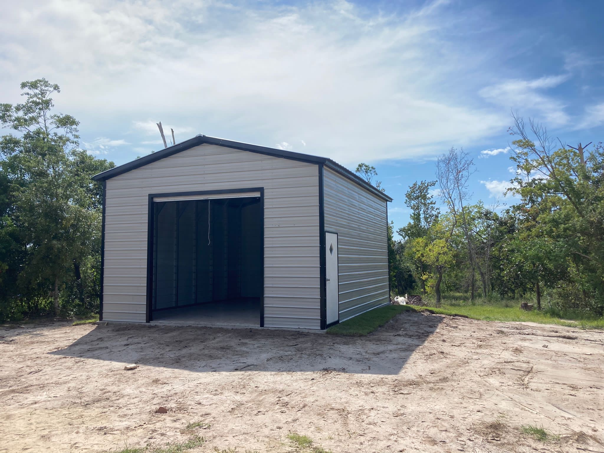 Metal garage with large opening