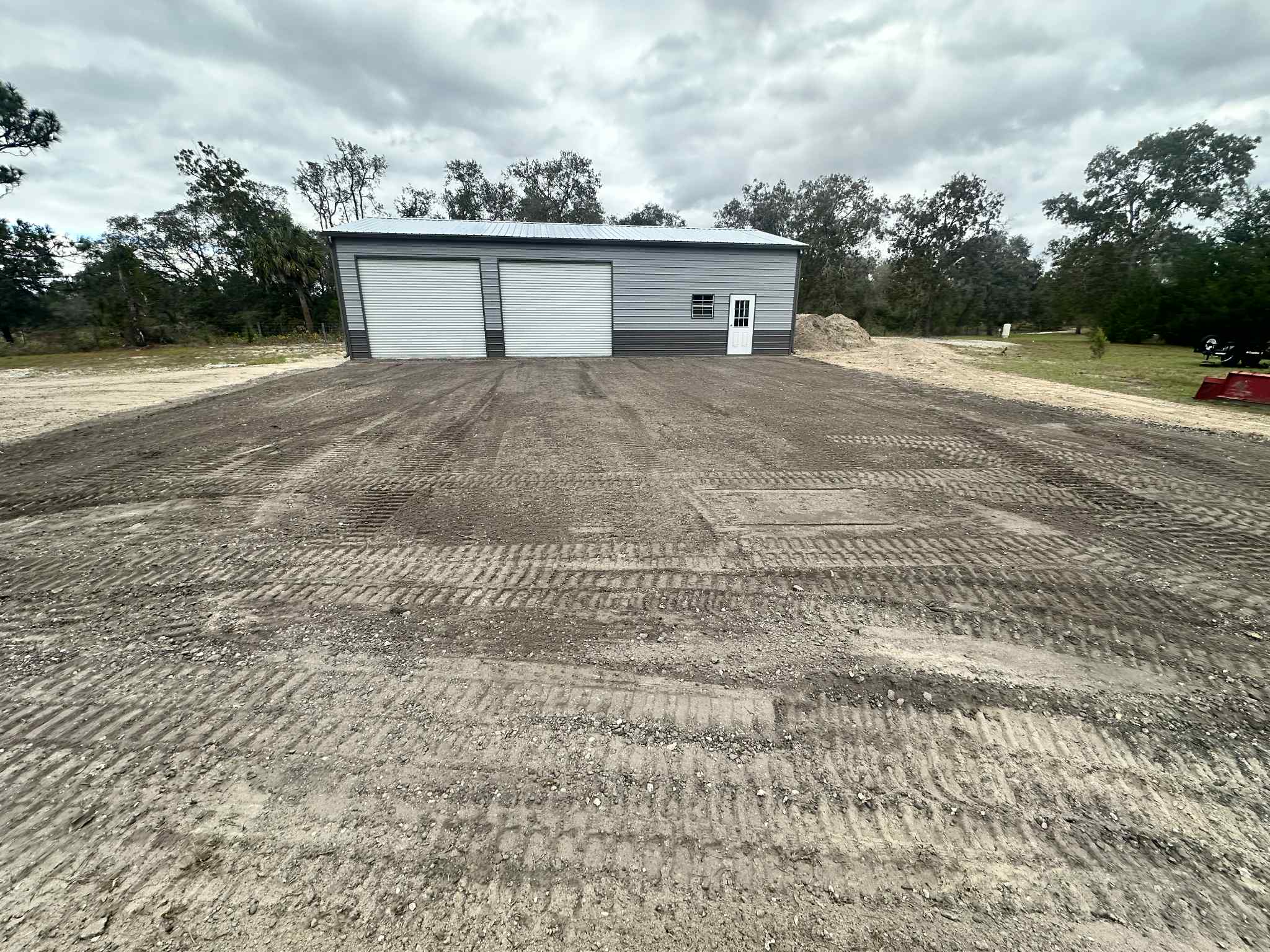 Wide view of workshop with site grading